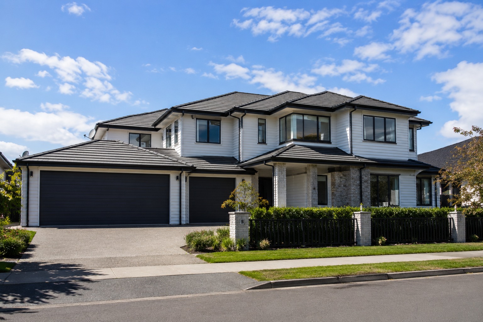 Large two-storey Auckland home with five or more bedrooms and extended guttering